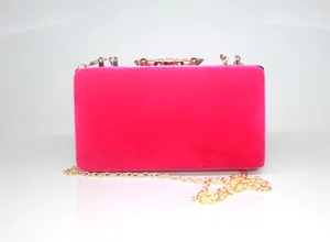 Elegant hot pink velvet evening clutch bag featuring a sparkling crystal crown clasp