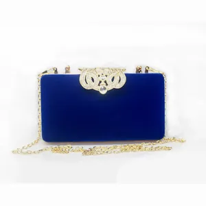 Luxury navy blue velvet evening clutch bag with rhinestone crown clasp and gold chain strap