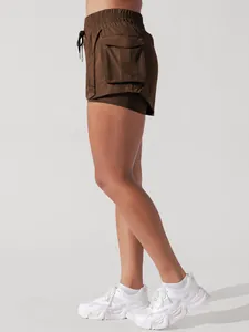 Side view detail of brown 2-in-1 athletic cargo shorts with functional side pocket