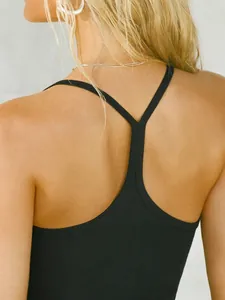 Detailed back view of a black ribbed backless tank top with slim fit Y-strap design.