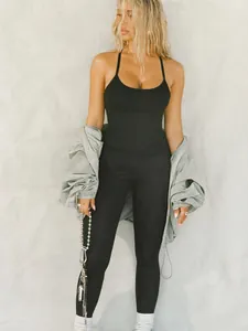 Slim fit black ribbed camisole tank top for women featuring thin spaghetti straps style