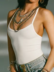 Detail view of a white ribbed halter tank top showing the premium fabric texture.