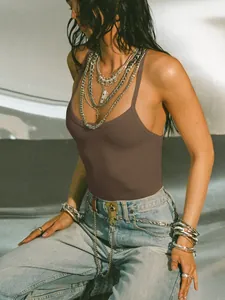Detailed view of women's brown ribbed tank top featuring slim fit and spaghetti straps