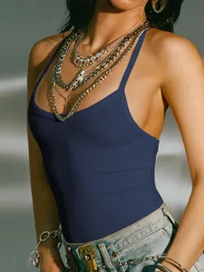Detail view of navy blue ribbed backless camisole styled with layered necklaces