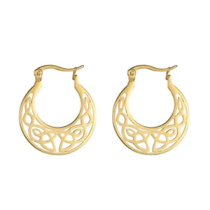 Detailed view of gold-plated stainless steel crescent earrings with hollow floral pattern