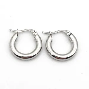 Close-up detail of 4mm thick stainless steel silver-colored round hoop earrings.