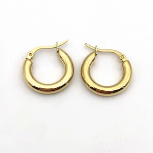 Macro view of polished gold chunky hoop earrings showing thick 4mm stainless steel design