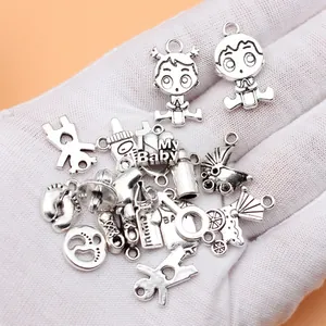 18-piece silver tone baby charm set with bottle, pacifier, stroller and footprint designs