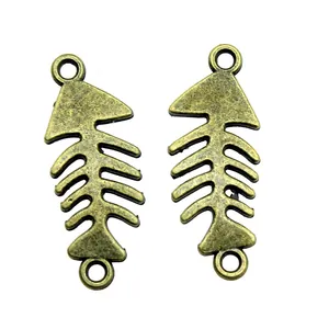 Two vintage antique bronze fish bone charms connectors for DIY jewelry making crafts