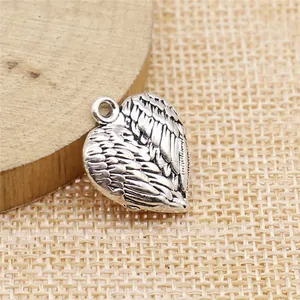 Antique silver heart-shaped pendant with intricate 3D wing pattern for jewelry making