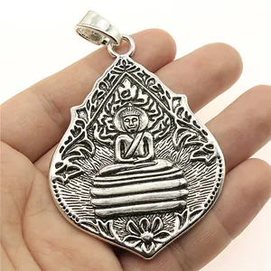 Oversized silver Bodhi leaf Buddha pendant necklace jewelry held in hand 72x54mm