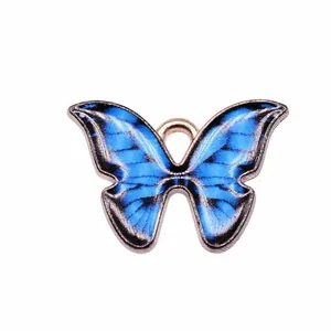 Pendentif papillon en émail bleu pour la création de bijoux DIY, taille 21x15mm.