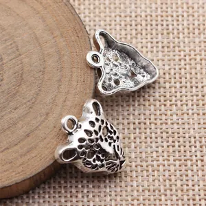 Two antique silver hollow leopard head charms for handmade DIY jewelry making projects