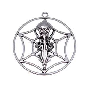 Vintage silver bird skull pendant with openwork spiderweb design for DIY jewelry.