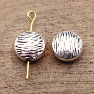 Textured flat round metal beads with scratch-like wood grain for jewelry making