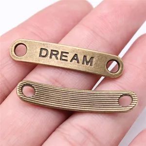 Connettore Dream 39x8mm in bronzo antico e barra metallica a righe per gioielli