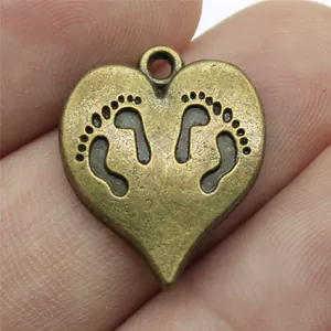 Vintage heart-shaped bronze pendant charm with engraved baby footprints for DIY jewelry