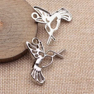 Elegant hollow hummingbird pendant for vintage DIY jewelry making in silver finish
