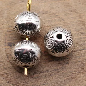 Antique silver spacer beads with intricate floral engraving for DIY jewelry making