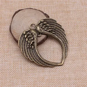 Grand pendentif double aile en forme de cœur en bronze antique pour bijoux DIY