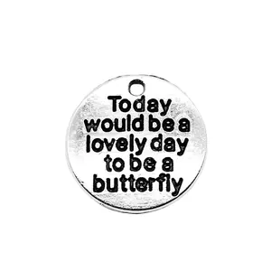 Ronde zilverkleurige metalen bedel met Today would be a lovely day to be a butterfly gravure