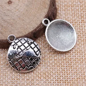 Antique silver globe charms for DIY jewelry making featuring a detailed world map relief