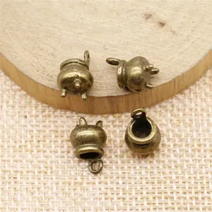 Set of vintage style antique bronze mini cauldron charms for DIY jewelry making projects