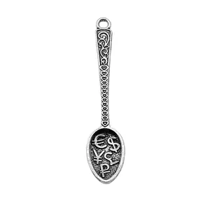 Vintage zinc alloy wealth spoon pendant featuring currency symbols and heart patterns
