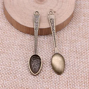 Vintage zinc alloy spoon pendant featuring engraved currency symbols for jewelry making