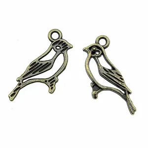 Antique bronze bird charms for DIY jewelry making with delicate hollow-out design