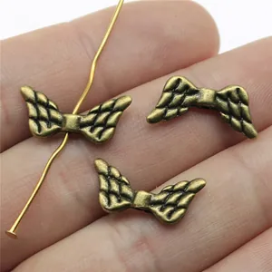 Vintage bronze wing-shaped spacer beads for DIY jewelry making and craft projects
