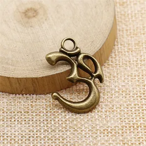 Pendentif symbole OM en bronze antique pour création de bijoux DIY 28x22mm 2.1g