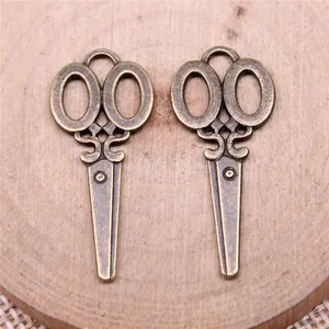 Antique bronze scissor-shaped alloy charms for DIY jewelry making, 34x15mm size.
