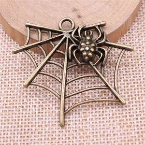 Vintage antique bronze spider and spider web charm pendant for handmade DIY jewelry crafting