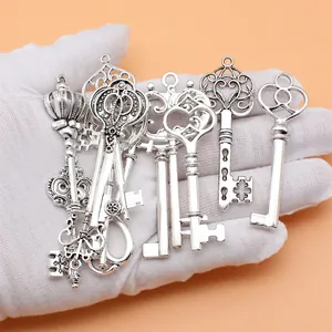 Set of 12 vintage antique silver key charms for DIY jewelry making and crafting