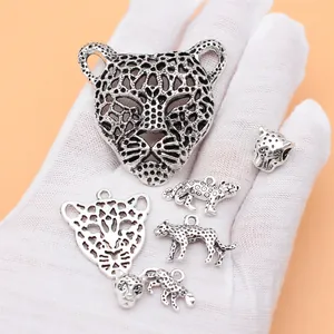 Antique silver leopard charm set with 7 unique wild cat designs for jewelry making
