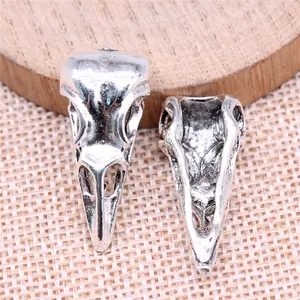 Antique silver bird skull pendant for DIY jewelry making 31x25x10mm.