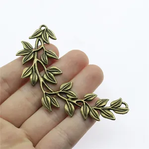 Antique bronze branch charm connector for DIY jewelry making with leaf details, 87x38mm.