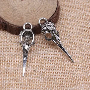 Antique silver-toned bird skull charm pendants for DIY jewelry crafting and accessories