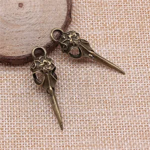 Antique bronze floral engraved bird skull pendants for DIY jewelry making, 41x12mm size