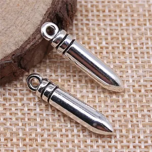 Shiny silver bullet-shaped alloy pendants for DIY jewelry crafting, 23x4mm size.
