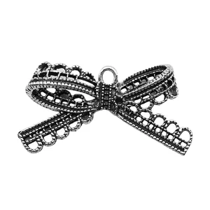 Vintage antique silver alloy bow charm with hollow lace design for DIY jewelry making
