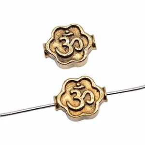 Antique gold 8x4mm OM flower charm beads for DIY jewelry making and handmade crafts.