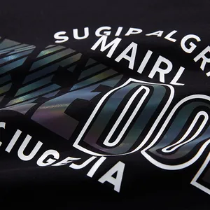 Black oversized fashion t-shirt featuring reflective holographic letter print design