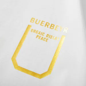 White oversized cotton t-shirt featuring premium gold foil lettering and stylish graphic print