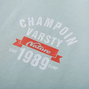 Close-up of men's loose T-shirt featuring vintage college style letter print design.