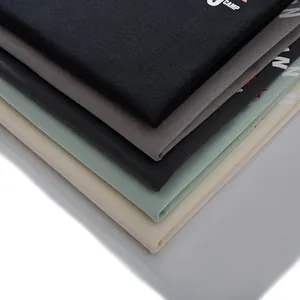 Folded stack of premium colorful plus size men's cotton T-shirts with letter print designs