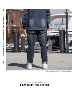 Rear view of men's plus size black straight-leg casual denim pants and denim jacket.