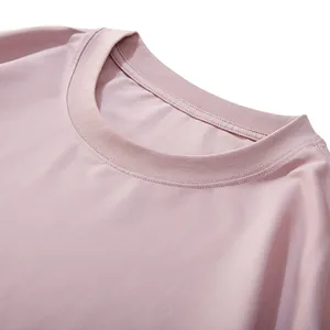 Detail shot of a pink crew neck cotton T-shirt showcasing high-quality fabric and stitching