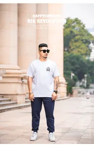 Model wearing plus size navy blue joggers and white t-shirt in outdoor setting